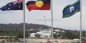 The Australian flag,the Aboriginal flag and the Torres Strait Islander flag flying in Canberra.