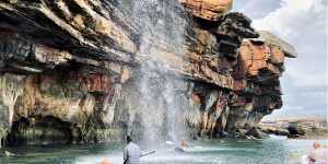 Guests can take kayaks and SUPs beneath waterfalls and beside intricate sandstone cliffs. 