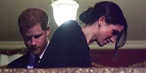 Side Bun alert! Prince Harry and Meghan Markle take their seats at the Royal Albert Hall in London for a concert to celebrate the Queen's 92nd birthday 