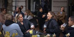 People chat and drink in Stockholm,which has not experienced the same lockdowns imposed on other European cities.