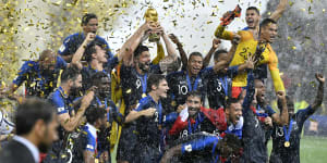 France's Olivier Giroud lifts the trophy after France defeated Croatia 4-2.