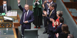 Opposition Leader Anthony Albanese is applauded by colleagues after delivering the budget reply in the House of Representatives last month. 