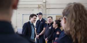 Canadian Prime Minister Justin Trudeau meets firefighters in Nova Scotia. Canada has endured a Black Summer of wildfires this year.