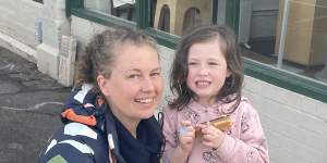 Jess O’Donnell and daughter Abby,4,bought some caramel slices.