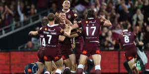 Lindsay Collins and his Maroons teammates celebrate the final try in Adelaide.