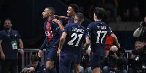 Kylian Mbappe and his teammates celebrate PSG’s opener against AC Milan.