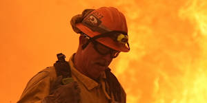 A firefighter battles the Canyon Fire on Thursday in Hasley Canyon,California.