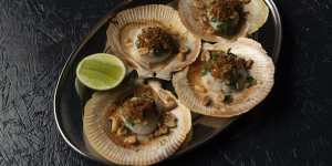 Grilled scallops with spring onion relish and peanuts.