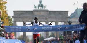 Kenya’s Eliud Kipchoge crosses the line to win the Berlin Marathon in September.