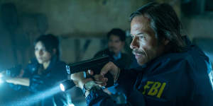 Guy Pearce,right,stars in the bloody action-thriller Memory.