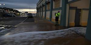 The waves were up and onto the road at Newcastle at sunrise this morning. 