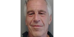 Jeffrey Epstein poses for a mugshot in 2013.