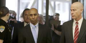 Former Minneapolis police officer Mohamed Noor walks through the skyway with his attorney Thomas Plunkett,right,on the way to court.