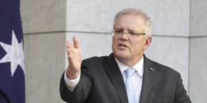 Australian Prime Minister Scott Morrison announces the $130 billion package to support workers with wage subsidies during a press conference to outline the government's economic response to the COVID-19 coronavirus pandemic,at Parliament House in Canberra on Monday 30 March 2020. 
