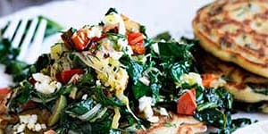 Spinach hotcakes with greens and feta.
