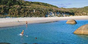 Greens Pool at William Bay National Park is rimmed by beach and stone.