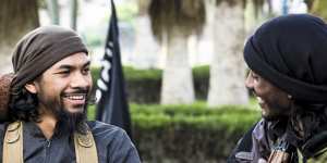 Neil Prakash,left,from a jihadist propaganda video in about 2015. Prakash,an Australian,is accused of fighting for Islamic State in Syria and being a key recruiter of Australians for the group.