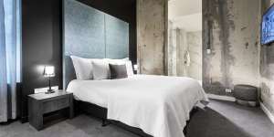 Dramatic,stripped-back concrete walls in The Melbourne Hotel’s original building.
