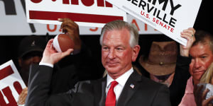 Tommy Tuberville throws toy footballs to supporters in 2020