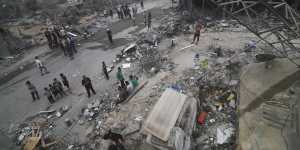Palestinians look for survivors after an airstrike in Rafah on Monday.