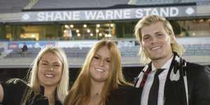Brooke,Summer and Jackson Warne in front of the newly named Shane Warne Stand at the MCG.