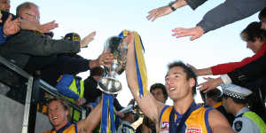 Glory days:Adam Hunter (right) at the 2006 AFL grand final. 