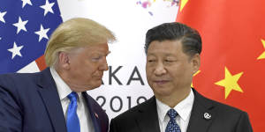 Donald Trump,pictured here with Xi Jinping in 2019,is obsessed by China,Bolton says.