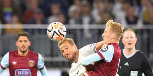 Harry Kane of Tottenham and Flynn Downes of West Ham tussle for the ball at Optus Stadium on Tuesday.