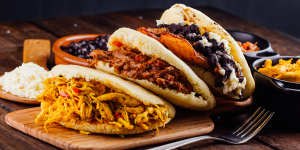 Colombians love the arepa,often filled with meat,black beans or fried plantain.