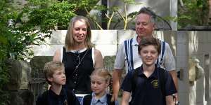 Andrew Mencinsky and his wife Stephanie with children Luca,10,Christian 8,and Olena,6,at home.