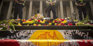 Police monitor the'Invasion Day'rally.