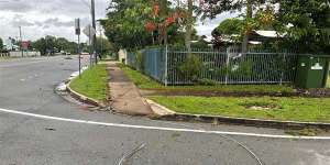 A fallen powerline on the footpath and road in the wake of Tropical Cyclone Kirrily.
