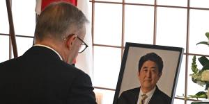 Prime Minister Anthony Albanese signs a condolence book for former prime minister Shinzo Abe at Japan’s embassy in Canberra in July.