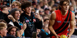 Harrison Jones receives encouragement from fans at Adelaide Oval.