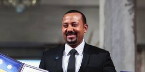 Ethiopia's Prime Minister Abiy Ahmed poses for the media after receiving the Nobel Peace Prize during the award ceremony in Oslo City Hall,Norway,last year.