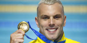 Kyle Chalmers shows off his gold medal after the men’s 100m freestyle final at the World Shortcourse Championships in Melbourne. 
