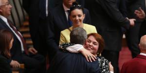 Senator Kimberley Kitching is embraced by then-opposition leader Bill Shorten after her first speech in the Senate at Parliament House in 2016. 