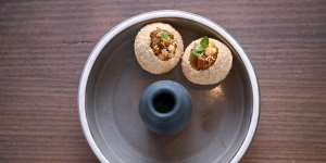 Pani puri filled with spiced potato,chickpeas,tamarind chutney and aromatic water. 