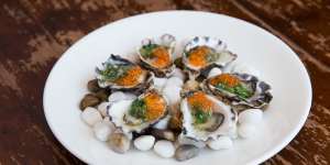Oysters dressed with jalapeno and salmon caviar.