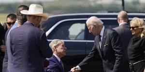 US President Joe Biden and first lady Jill Biden meet Governor Greg Abbott,of Texas,ahead of their visit to Robb Elementary School.