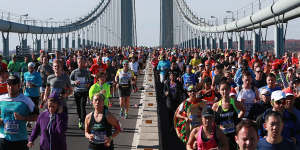 Runners cross the Verrazano-Narrows Bridge at the start of the New York City Marathon.