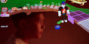 In a multiple exposure image,a 10-year-old Sydney boy looks at a game hosted on the Roblox platform.