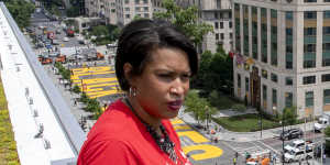 District of Columbia mayor Muriel Bowser stands on the rooftop of the Hay Adams Hotel near the White House and looks out at the words'Black Lives Matter'that have been painted in bright yellow letters on the street.