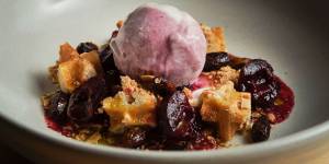 Busted buttermilk waffle,cherry ice-cream,poached cherries and pistachio.