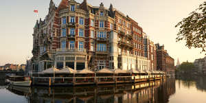 Board a classic wooden boat from the hotel’s riverside terrace for a private guided canal tour to the Van Gogh Museum.