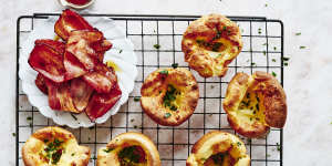 Mini Dutch babies with maple syrup and crispy bacon.