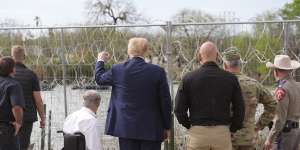 Republican presidential candidate Donald Trump gestures to people yelling from across the Rio Grande in Mexico as he visits the border in Eagle Pass,Texas,last month.