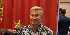 Tommy Zegan with his golden Donald Trump statue at the Conservative Political Action Conference in Orlando.