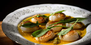 Abrolhos Islands scallops with roast garlic,chilli and coriander butter,lemon and sheep sorrel.