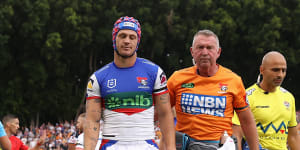 Newcastle’s Kalyn Ponga leaves the field after being concussed against the Tigers last year.
